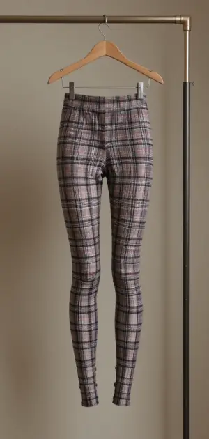 High-waisted plaid leggings in beige, brown, and black tones.