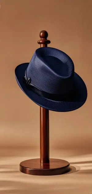 Fedora hat with silk finish on rack.