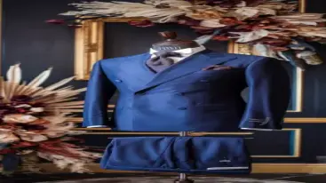 Deep blue double-breasted suit on a mannequin with elegant floral decor