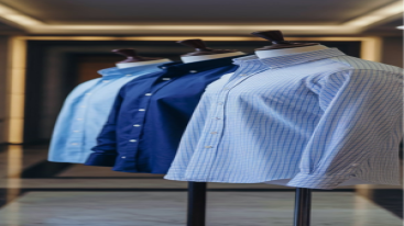 Assorted cotton dress shirts in various colors and patterns displayed on mannequins