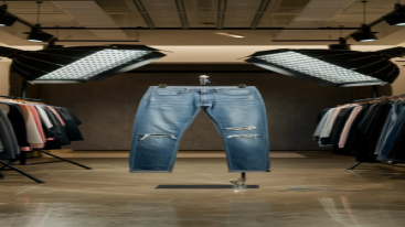 Classic ripped blue jeans with a brown belt on a stand in a modern store setting