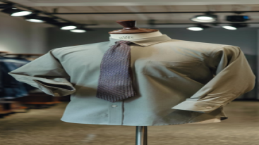 Light beige formal shirt with a patterned tie on a mannequin