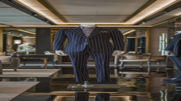 Mannequin displaying a pinstripe suit in a luxurious office backdrop